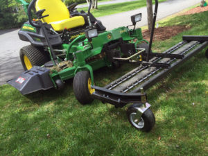 zero-turn mower with thatching attachment
